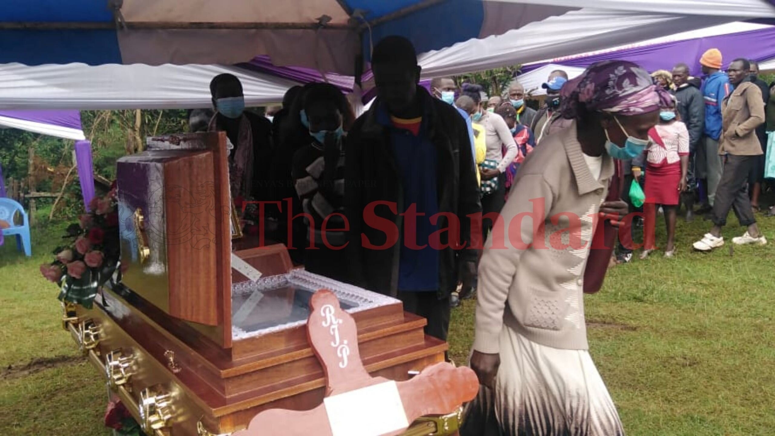 Caroline Kangogo's body was fitted with wedding dress as per her request. Her casket was partially opened to allow mourners to view her body. 